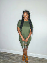 Load image into Gallery viewer, Woman wearing a dark olive 2 piece set standing against a white wall.
