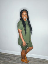 Load image into Gallery viewer, Woman wearing a dark olive 2 piece set standing against a white wall.
